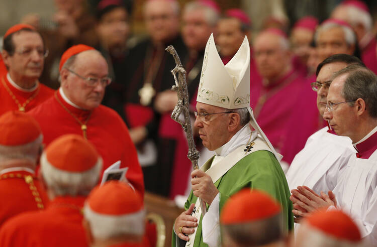 Pope Francis arrives to celebrate Mass in St. Peter's Basilica to open extraordinary Synod of Bishops on the family. (CNS photo/Paul Haring)