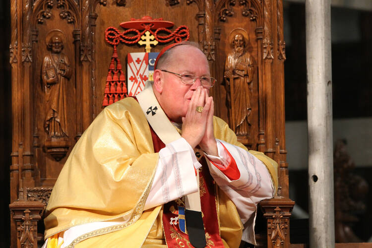 Cardinal Timothy M. Dolan of New York presides at an August Mass at St. Patrick's Cathedral in New York. (CNS photo/Gregory A. Shemitz) 