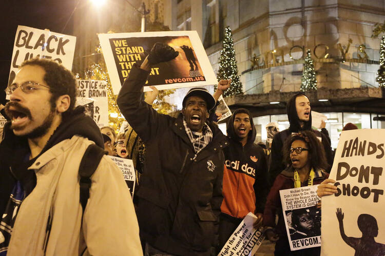 A Nov. 24 march in Seattle protested the lack of an indictment in the Michael Brown case. (CNS photo/Jason Redmond, Reuters)