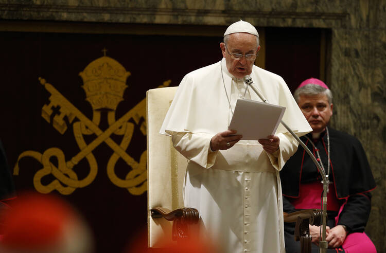 Pope Francis delivers his Christmas greeting to the Roman Curia in Clementine Hall at the Vatican on Dec. 22, 2014. (CNS photo/Paul Haring)