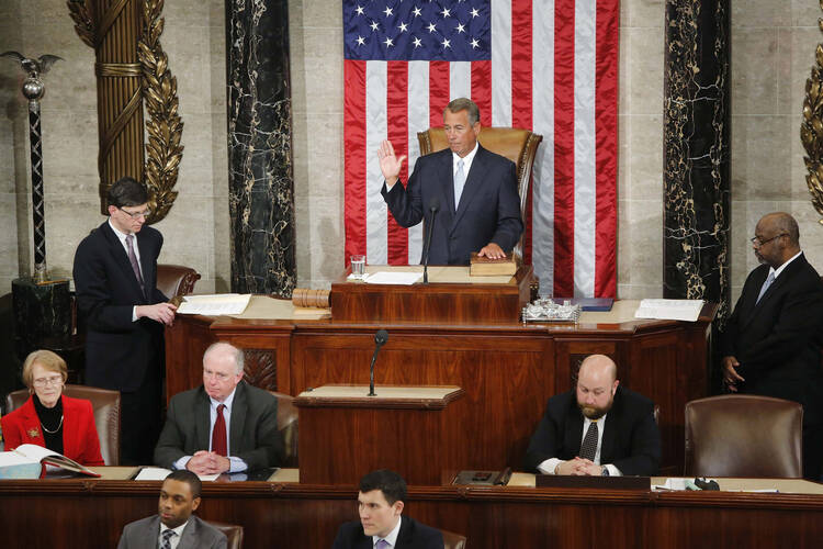 John Boehner at a more hopeful time, taking the oath of office after being re-elected Speaker of the House in January. (CNS photo/Jonathan Ernst, Reuters)