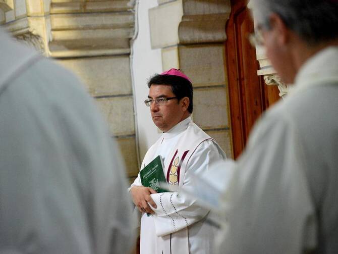 Bishop Oscar Cantu of Las Cruces, N.M., prays during Mass with other bishops from around the world on Jan. 12 at the Carmelite Monastery in Bethlehem, West Bank. (CNS photo/Debbie Hill) 