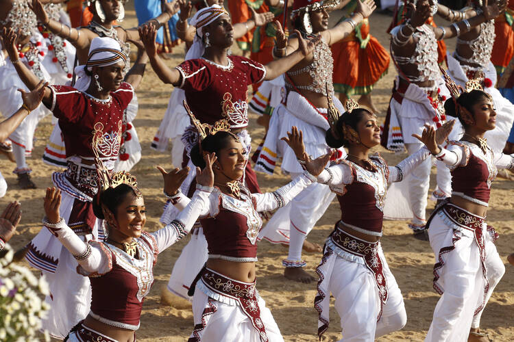 Dancers perform before Pope Francis celebrates the canonization Mass of St. Joseph Vaz at Galle Face Green in Colombo, Sri Lanka, Jan. 14. (CNS photo/Paul Haring)