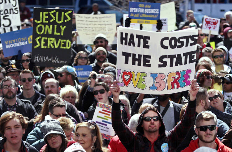Demonstrators gather in Indianapolis to protest new religious freedom law.