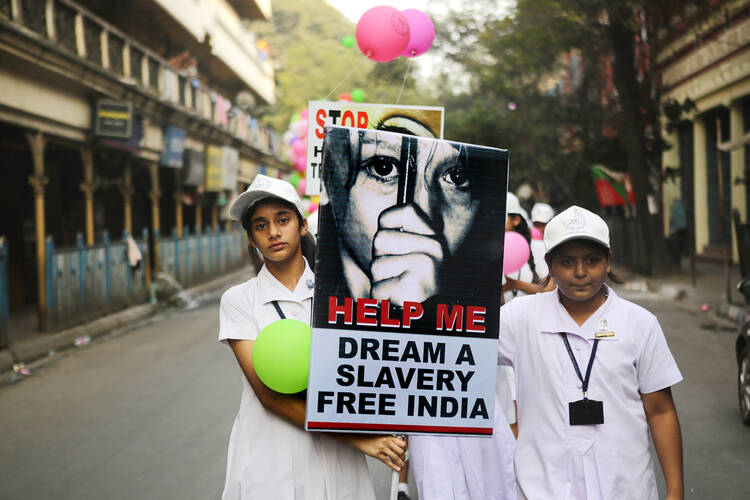 Students from the Archdiocese of Calcutta take part in a walk for peace against human trafficking in early February in Kolkatta, India. (CNS photo/Piyal Adhikary, EPA)