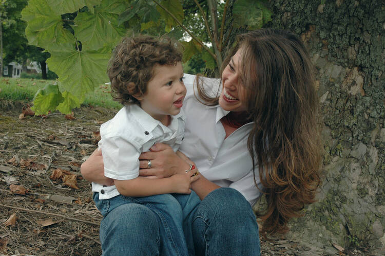 A mother and child are seen enjoying time together in a park in Indianapolis. (CNS)