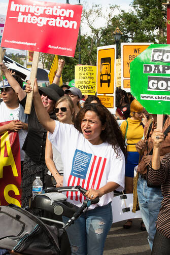 International Workers' Day supporters gather in downtown Los Angeles May 1 to raise awareness about minimum wage and immigration issues. 