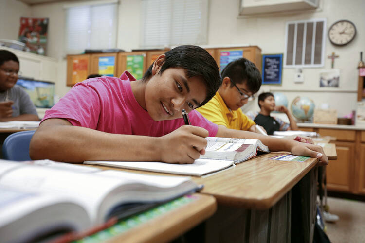 Student works on assignment at St. Peter Indian Mission School in Arizona.