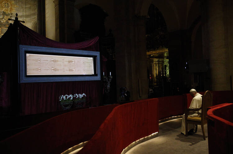 Pope Francis prays in front of the Shroud of Turin in the Cathedral of St. John the Baptist in Turin, Italy, June 21. (CNS photo/Paul Haring)