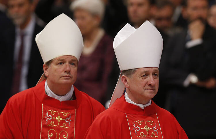 Archbishops Fisher, Cupich leave after Mass marking feast of Sts. Peter and Paul in St. Peter's Basilica at Vatican.