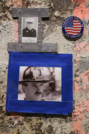 Photo of firefighter and Father Mychal Judge seen on beam at National September 11 Memorial & Museum in New York City