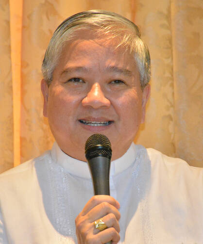 Archbishop Socrates Villegas, head of the Catholic Bishops' Conference of the Philippines, talks to the media at the end of the bishops' plenary session in Manila July 13. (CNS photo/Simone Orendain)