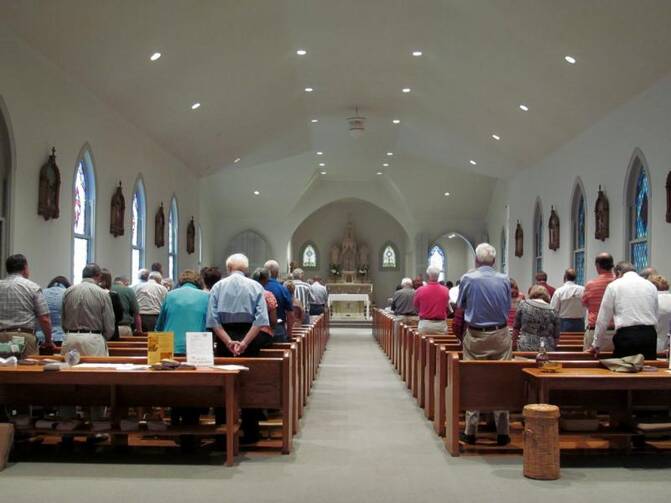 In this May 31, 2014 file photo, Mass is celebrated at Immaculate Heart of Mary Church in Greenwood, Mississippi, the older of two Catholic parishes in the small Mississippi Delta city that share a pastor and some functions. (CNS photo/Patricia Zapor)