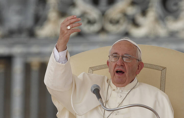 Pope Francis gestures as he speaks during his general audience in St. Peter's Square at the Vatican Sept. 9. (CNS photo/Paul Haring) 