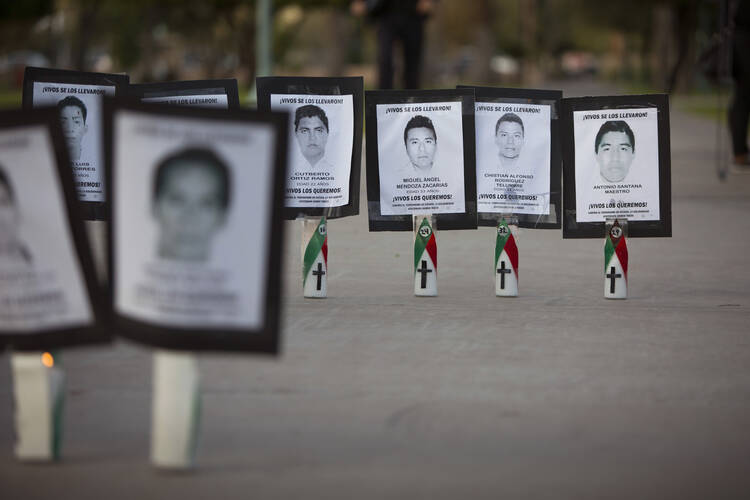 Images of college students who went missing in Mexico's Guerrero state are set outside the Arizona State Capitol in Phoenix by immigration reform advocates in this file photo from Nov. 20, 2014. (CNS photo/Nancy Wiechec) 