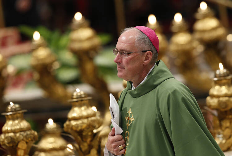 Canadian Archbishop Paul-Andre Durocher of Gatineau, Quebec, arrives for the opening Mass of the Synod of Bishops on the family celebrated by Pope Francis in St. Peter's Basilica at the Vatican Oct. 4. (CNS/Paul Haring) 