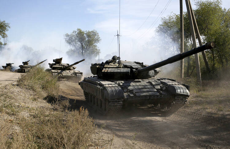 Soldiers of the self-proclaimed Luhansk People's Republic movement withdraw from the front line outside Luhansk, Ukraine, Oct. 3. (CNS photo/Alexander Ermochenko, Reuters)