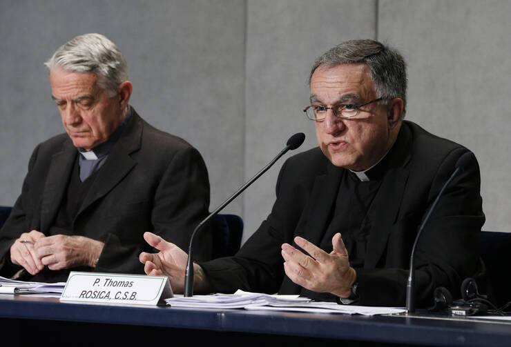 Father Thomas Rosica with Jesuit Father Federico Lombardi during the Synod of Bishops in Rome, October 2015. (CNS/Paul Haring)
