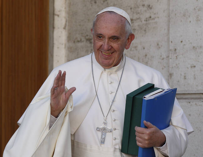 Pope Francis waves as he leaves a session of the Synod of Bishops on the family at the Vatican Oct. 24. (CNS photo/Paul Haring) 