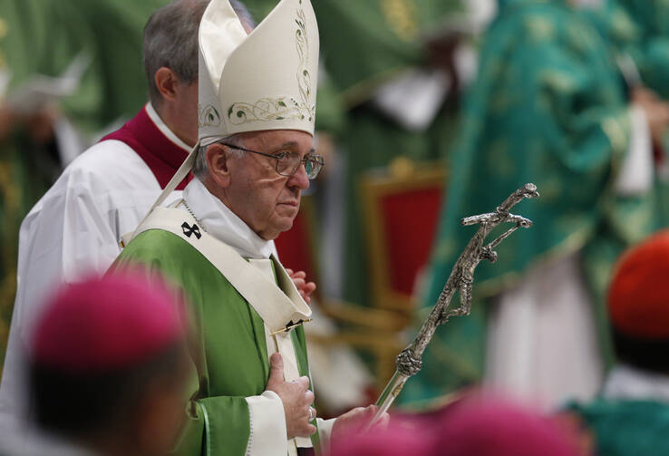 Pope Francis arrives to celebrate the closing Mass of the Synod of Bishops on the family in St. Peter's Basilica at the Vatican Oct. 25. (CNS photo/Paul Haring) 