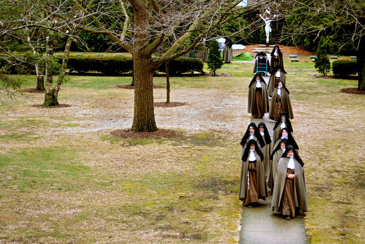 In this 2010 photo, Poor Clare Colettine nuns walk back to their Corpus Christi Monastery in Rockford, Ill., after a funeral service for one of the cloister's elderly sisters. (CNS photo/Abbie Reese) 