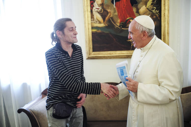 Pope Francis meets Marc, a street paper vendor from Utrecht, Netherlands, at the Vatican in October 2015. Marc conducted an exclusive interview with the pope for all street papers, through the news service of the International Network of Street Papers. INSP supports 113 street papers across the world, who offer employment to 13,000 homeless and marginalized people in 34 countries. (CNS photo/courtesy of Frank Dries, Straatnieuws) 