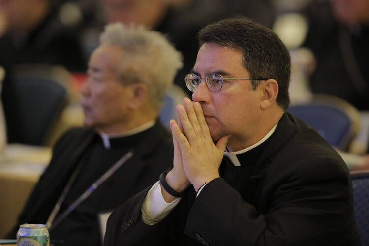 Bishop Oscar Cantu of Las Cruces, N.M., prays on Nov. 16 during the opening of the 2015 fall general assembly of the U.S. Conference of Catholic Bishops in Baltimore. (CNS photo/Bob Roller)