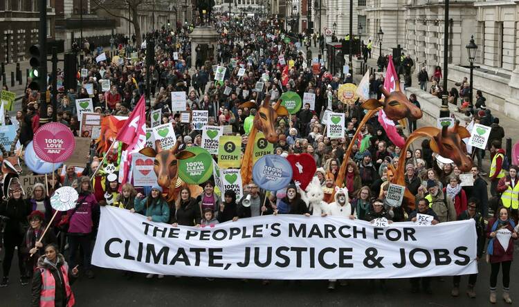 Protesters demonstrate during a rally in London Nov. 29, ahead of the U.N. climate change conference, known as the COP21 summit, in Paris. (CNS photo/Suzanne Plunkett, Reuters) 