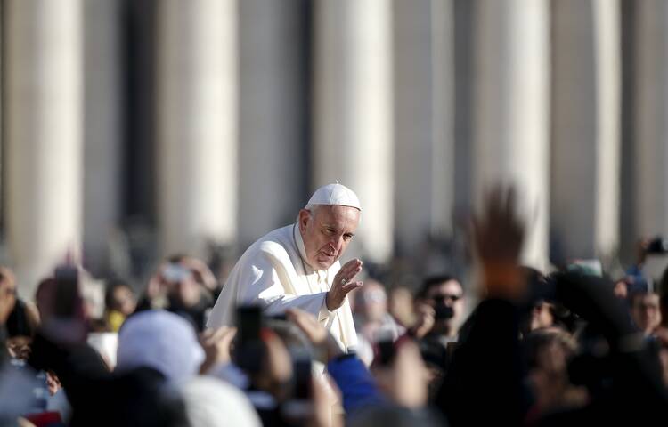 Pope Francis waves as he arrives to lead his weekly audience in St. Peter's Square at the Vatican Dec. 2. (CNS photo/Alessandro Bianchi, Reuters) 