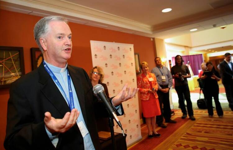 Pope Francis has named Irish Msgr. Paul Tighe a bishop and appointed him as adjunct secretary of the Vatican's Pontifical Council for Culture. Bishop-elect Tighe, who served as secretary of the Pontifical Council for Social Communications, is pictured at the 2013 Catholic Media Conference in Denver in this June 20, 2013, file photo. (CNS photo/Nancy Phelan Wiechec) 