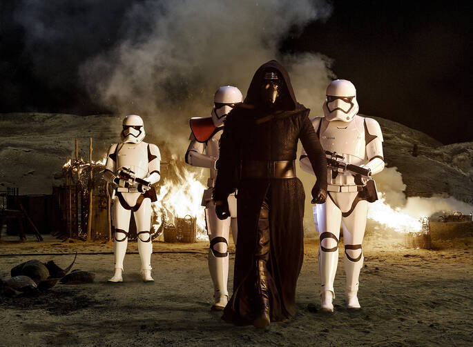  Adam Driver, who plays villain Kylo Ren, stars in a scene from the movie "Star Wars: The Force Awakens." (CNS photo/Disney) 