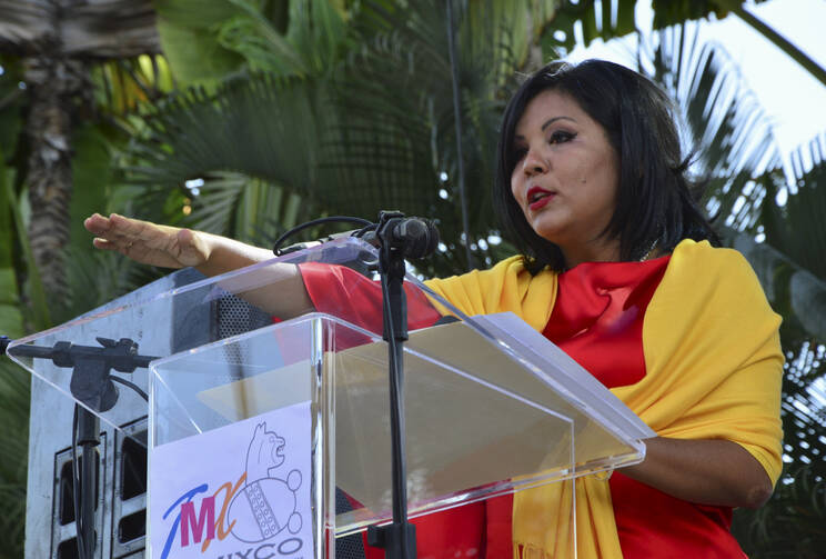 Gisela Mota takes the oath of office as new mayor of Temixco, Mexico, Jan. 1. She was killed the next day at her home by four gunmen. (CNS photo/Stringer, Reuters) 