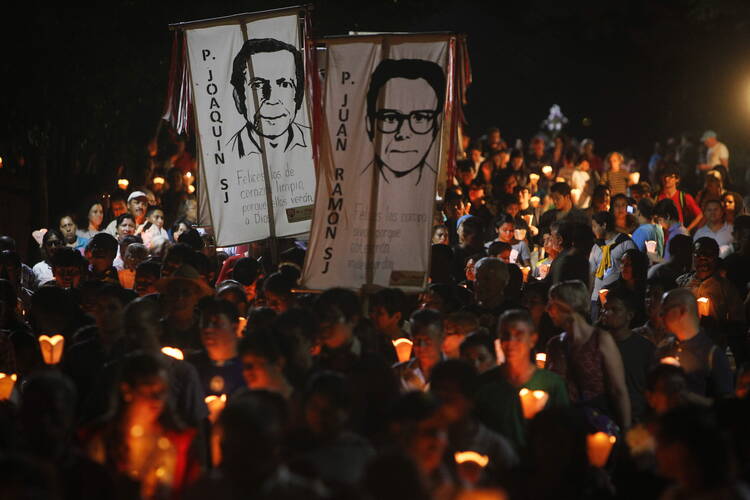 The "little lanterns march" at the Central American University in San Salvador during the 2015 commemoration of the 26th anniversary of the massacre of six Jesuit priests and two women, murdered in November 1989 by a military commando. (CNS photo/Oscar Rivera, EPA)