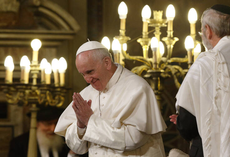 Pope Francis gestures as he visits the main synagogue in Rome Jan. 17. At right is Rabbi Riccardo Di Segni, the chief rabbi of Rome. (CNS photo/Paul Haring) 