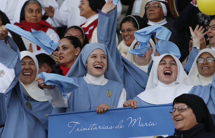 Nuns cheers before Pope Francis' arrival to celebrate Mass with priests and religious at a stadium in Morelia, Mexico, Feb. 16. (CNS photo/Paul Haring) 