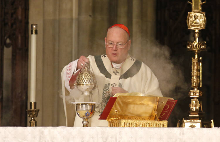Cardinal Timothy M. Dolan of New York uses a censer while celebrating a St. Patrick's Day Mass March 17, 2017 at St. Patrick's Cathedral in New York City. (CNS photo/Gregory A. Shemitz)