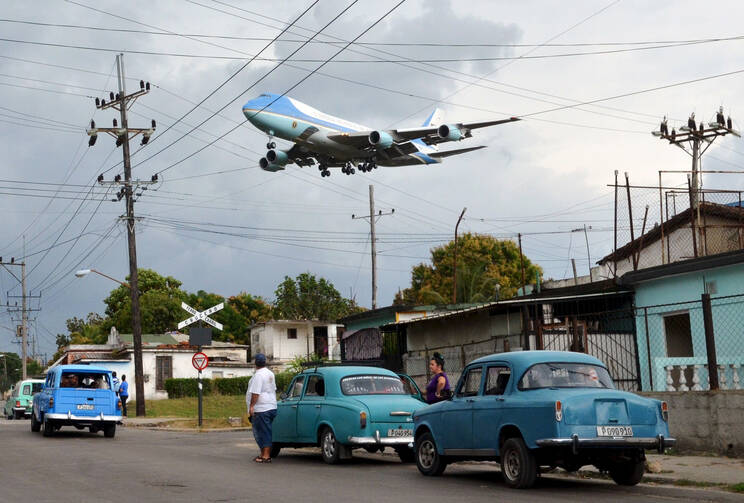 Air Force One carrying U.S. President Barack Obama and his family flies over a Havana neighborhood in Cuba as it approaches the runway March 20. (CNS photo/Alberto Reyes, Reuters)