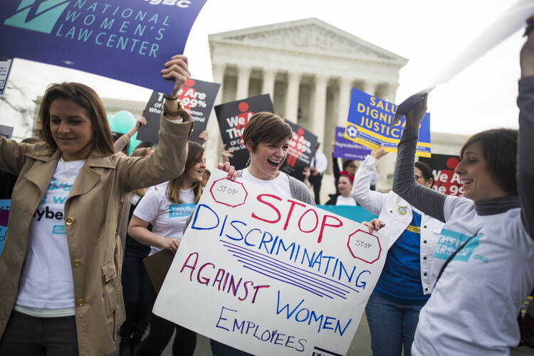 Women lobby in support of the Affordable Care Act's contraceptive mandate on March 23 outside the U.S. Supreme Court ahead of oral arguments in Zubik v. Burwell in Washington. (CNS photo/Jim Lo Scalzo, EPA)