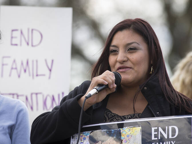 Beatriz Mejia of El Salvador speaks at a rally in front of the White House in Washington in March 2016 in support of immigrant families who are seeking asylum. (CNS photo/Tyler Orsburn)