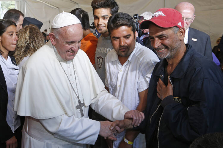 Pope Francis meets refugees at the Moria refugee camp on the island of Lesbos, Greece, April 16, 2016. (CNS photo/Paul Haring)