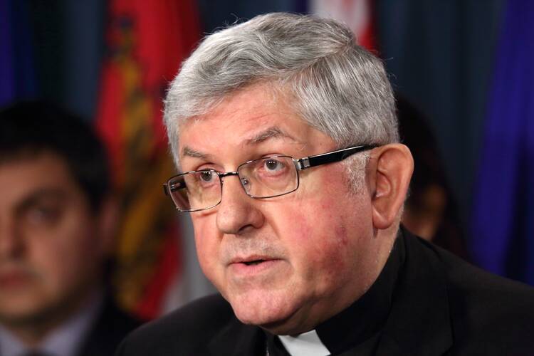 Cardinal Thomas Collins of Toronto speaks out against euthanasia and physician-assisted suicide during an April 19 news conference on Parliament Hill in Ottawa, Ontario. (CNS photo/Art Babych) 