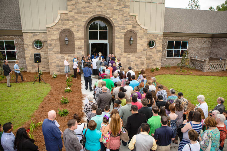 Parishioners of St. Anthony of Padua, in Ray City, Ga., enter their new church at its dedication on May 21, 2016. (CNS photo/Rich Kalonick, Catholic Extension)