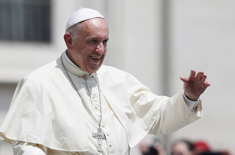 Pope Francis waves as he leaves his general audience in St. Peter's Square at the Vatican June 8. (CNS photo/Paul Haring) See POPE-AUDIENCE-CANA June 8, 2016.