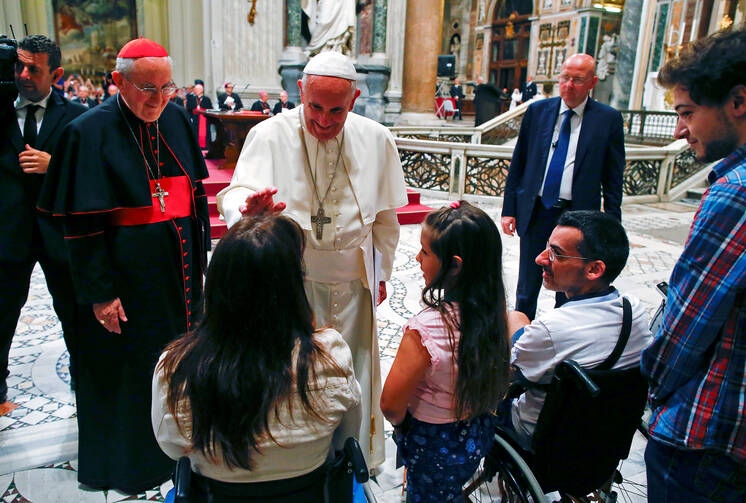 Pope Francis blesses a woman as he meets the disabled during the opening of the Diocese of Rome's annual pastoral conference at the Basilica of St. John Lateran in Rome June 16. (CNS photo/Tony Gentile, Reuters) 