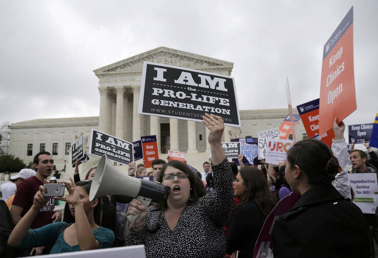 A pro-life supporter in front of the U.S. Supreme Court in June 2016. (CNS photo/Andrew Gombert, EPA)