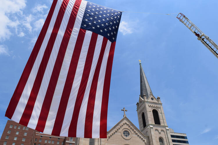 Flagging liberty? Outside Sacred Heart Church in downtown Peoria, Ill, June 2016. (CNS photo/Tom Dermody, Catholic Post)