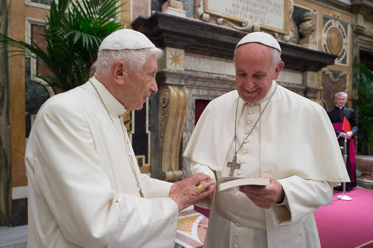 Pope Francis is not the first: Pope Benedict XVI also called for a “civil economy,” in his encyclical “Caritas in Veritate.” (Retired Pope Benedict XVI being greeted by Pope Francis on June 28, 2016. CNS photo/L'Osservatore Romano, handout)