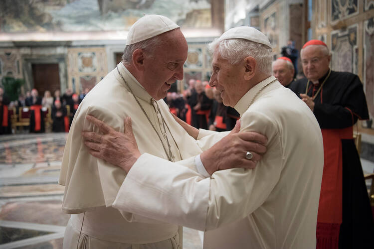 Pope Francis greets retired Pope Benedict XVI during a June 28 ceremony at the Vatican marking the 65th anniversary of the retired pope's priestly ordination. (CNS photo/L'Osservatore Romano, handout) 