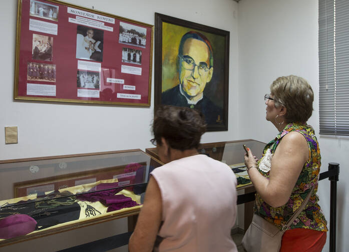 Women look at relics and other items of Blessed Oscar Romero at Divine Providence Hospital in San Salvador March 22, 2015. (CNS photo/Octavio Duran)