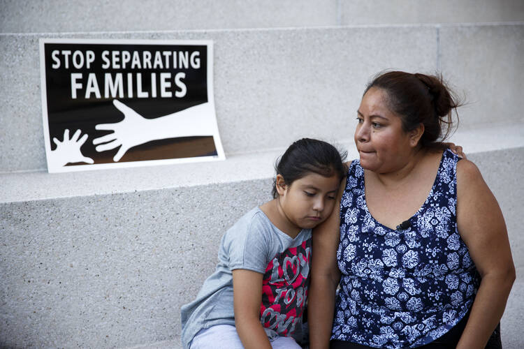 A mother and daughter in Los Angeles react after the U.S. Supreme Court issued a split ruling on June 23 blocking President Barack Obama's executive actions to temporarily stop deportations. (CNS photo/Eugene Garcia, EPA) 